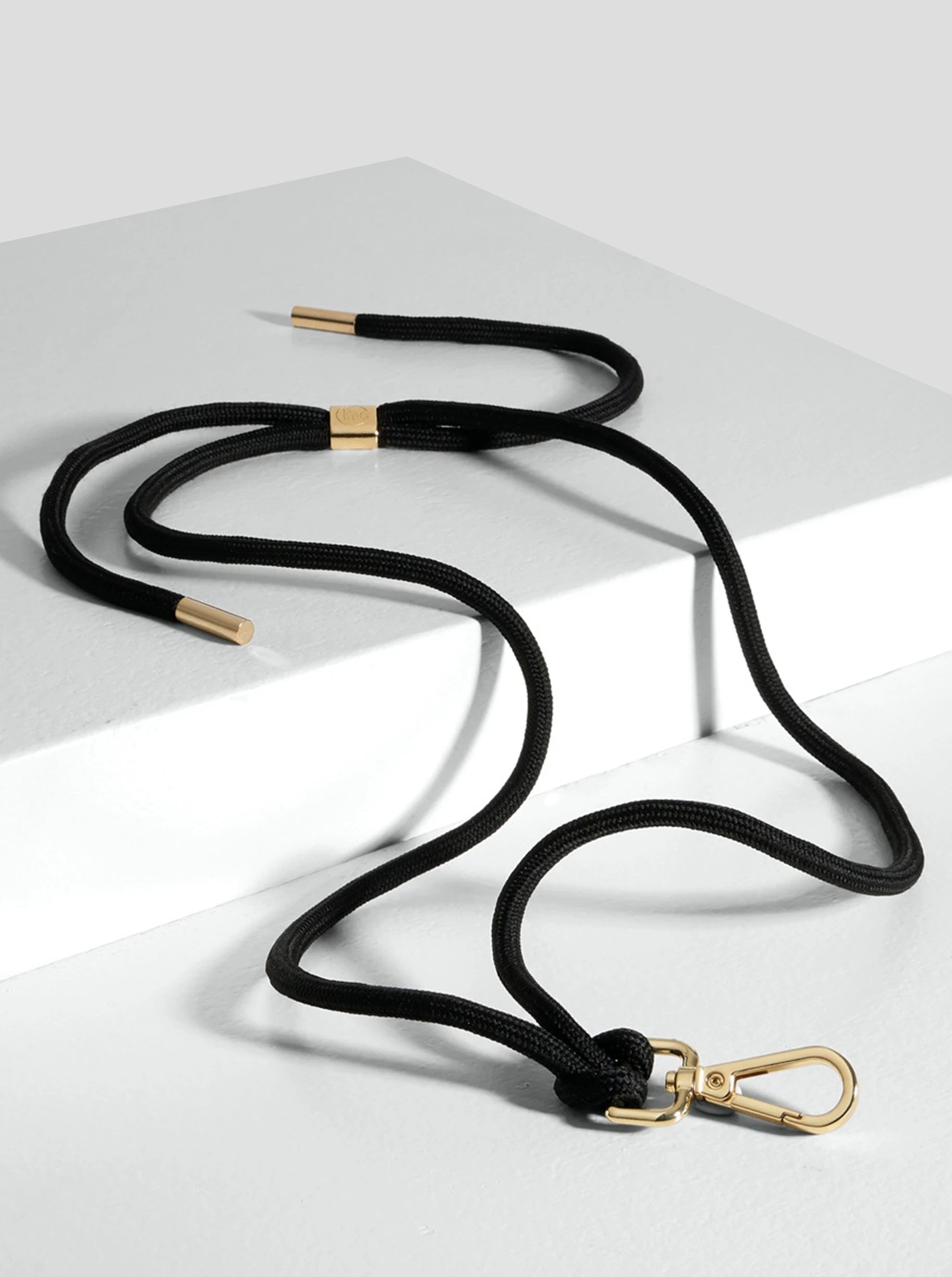 Gold and black phone strap